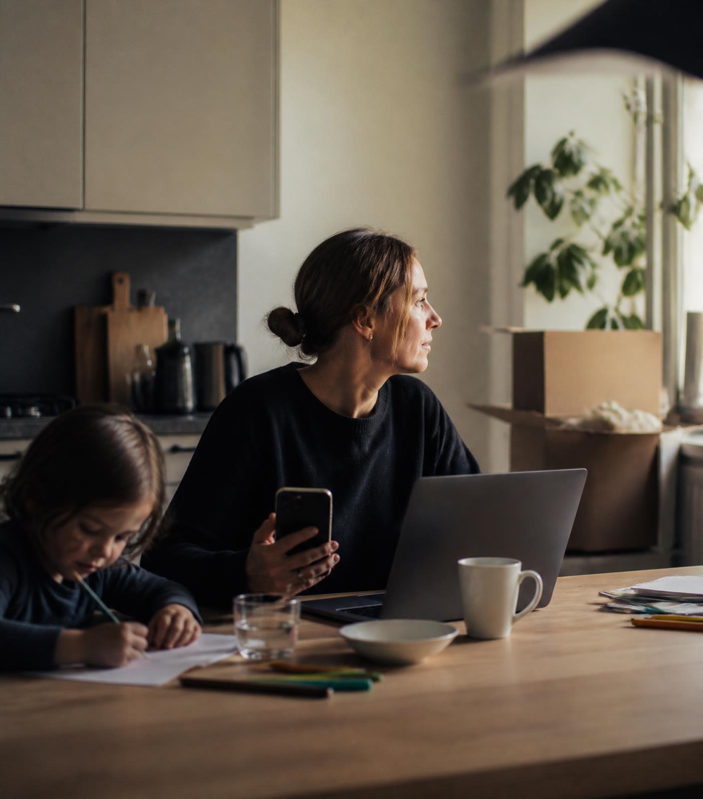 Relocating family at their dining table in their new home